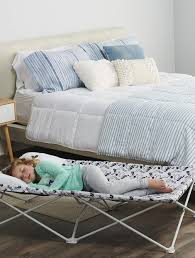 The bed liner is made from a sturdy canvas material with reinforced stitching for added security. Amazon Com Regalo My Cot Pal Extra Long Portable Toddler Bed Eye Lashes White Small Single Baby