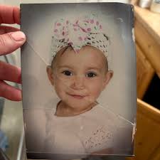 Can anyone please help restore this picture the glass is stuck to the image  and has torn it lose the glass and tares