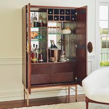 This bar cabinet is lovely placed in a living room or kitchen. Ecuador Wood Brass Bar Cabinet Plantation Design