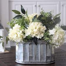 Silk flowers and artificial plants make for unfussy—yet chic—home decor accents. A Neutral Farmhouse Arrangement Perfect For Any Home Flower Arrangements Floral Arrangements Farmhouse Centerpiece