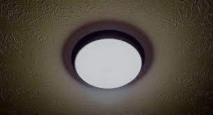 At the bottom of the light fixture's light socket is a brass tab. The Pros Cons Of Led Integrated Lighting Fixtures