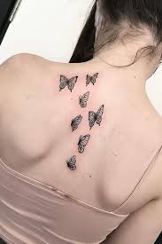 Elegant looking back tattoo down he center of the back. 30 Glamorous Back Tattoo Ideas For Women Ideasdonuts