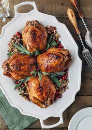 Cornish Hens With Apple Cranberry Rice Stuffing Recipe Thanksgiving Main Dish Recipes Cornish Hen Recipe Thanksgiving Main Dishes