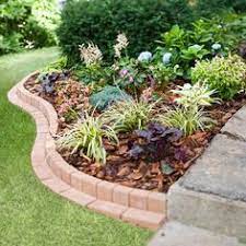 How To Plant A Curved Brick Flowerbed Border Brick Garden Edging Brick Garden Planting Flowers