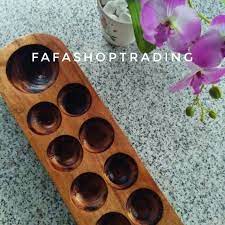 Before the game starts the 'houses' are filled with seven congkak seeds each while the 'storehouses'. Congkak Kayu Handmade Pak Cik Midi Permainan Tradisional Melayu Free Guli Shopee Malaysia
