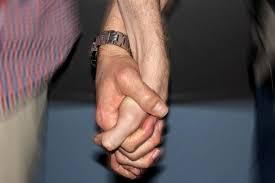 This emoji shows to two men who are holding hands. Two Men Hold Hands Abc News Australian Broadcasting Corporation