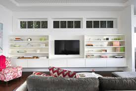 You know how the living room has the one big window that looks out to the front, and then the other wall with two windows? These Living Room Shelving Ideas Will Make Your Organizing Dreams Come True