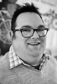 Michigan businessman Thomas Coke signs