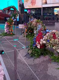A NEW Sunrise on the Reaping floral installation has appeared in Times  Square NYC with a Haymitch quote from the book: “Hoping for something  better could be dangerous” The pop-up will be