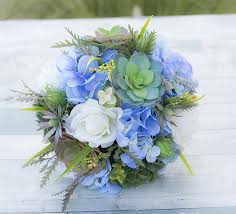 Brides will love these pretty hydrangea wedding bouquets. Natural Touch Off White Roses Silk Blue Hydrangeas And Succulent Bouquet Perfect For A Garden Fresh Wedding