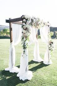 Dragon Ridge Country Club Wedding With Wood Arch Draped With Ivory Sheers And Asymmetrical Flor Outdoor Wedding Decorations Wedding Decorations Outdoor Wedding