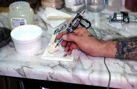Quality tattoo ink gives you the control, the precision, and the predictability you need to ensure that your tattoos are safe, vibrant, and hold their color for as long as possible. Florida Memory Tattoo Artist Jon Fort Dipping The Needle Into Ink Pensacola Florida
