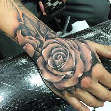 A brightly colored rose and jewels, as well as the thorns, present a look that means so much to a man. 47 Rose Hand Tattoos For Women Hand Tattoos For Guys Rose Hand Tattoo Hand Tattoos For Women