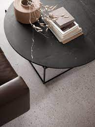 This circle coffee table is crafted from metal and wood, which ensure its sturdiness and durability, and also brings warmth to your living room. Circle Coffee Tables From Wendelbo Architonic
