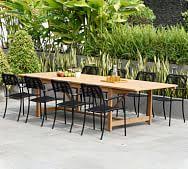 Brushed steel accents add a nice touch to this glossy white extendable table. Dining Table Seats 12 Pottery Barn