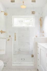 Bifold shower enclosures and doors. Glass And Marble Shower Enclosure With Brass Shower Door Handle Transitional Bathroom