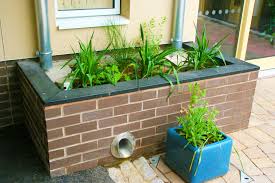 Rainplanter Rain Planter At Offmore School Uk Suds Storage Integrated Into Architectural Planter By Robert Bra Planters Architectural Planters Rain Garden