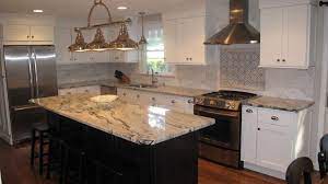 There is much more to come on kitchen design tips, ideas, resources, and more, so if you haven't subscribed already, be sure to do so before you leave! Love This Silver Cloud Granite With White Cabinets And Black Island Kitchen Remodel Countertops Black Granite Countertops Silver Cloud Granite Countertops