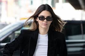 (we need not remind you of the iconic images of mark wahlberg in his kendall jenner squeezes a juicy grapefruit in one shot and seductively strokes a rosebud with her lips in another. Kendall Jenner Sports The Square Sandal Trend For Calvin Klein Footwear News