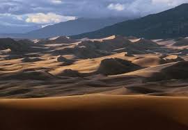 The sand dunes can seem unassuming against the backdrop of the sangre de cristo mountains but check out this video about sand sledding produced by great sand dunes national park and group sites are available as well. Great Sand Dunes National Park And Preserve Articles Colorado Encyclopedia