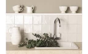 For a different feel, go with a textured backsplash such as brick. Painting Tiles Expert Diy Advice On How To Paint Tiles Easily Real Homes