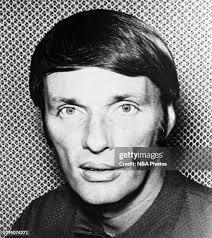 Jerry West of the Los Angeles Lakers dribbles against Pete Cross of... News  Photo