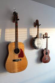 5 Simple Yet Stylish Ways To Display Stringed Instruments Hang Guitar On Wall Guitar Display Ukulele Wall Mount