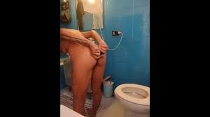 Anal douching & clit masturbation. Pushing out my asshole full of water.  Orgasm on the toilet.