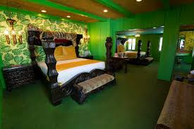 Take your little boy's bedroom to the wild side with a jungle themed adding a globe light and suitcase storage really makes you feel like you're on a jungle safari! Room 193 Safari Madonna Inn