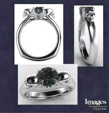 Our Angels And Demons 2 Engagement Ring Has A 1 Carat Black Diamond Center And White Diamond Ey Skull Engagement Ring Skull Wedding Ring Custom Wedding Rings