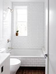 This white and gray bathroom features ikea vanities and herringbone floor. Bathroom Elements Dark Shower Grout White Subway Tile Bathroom Shower Grout White Bathroom Tiles