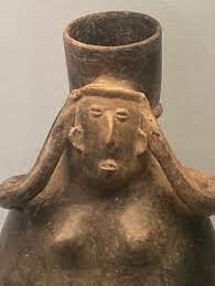 A woman carrying a large vessel with a “mecapal” (a tumpline or woven head  strap). Tomb art from Jalisco, Late Preclassical or Early Classic period,  300 BC to 600 AD. Burnished earthenware