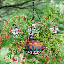 Inside, the plant (literally covered in flowers) was wrapped in a heavy paper sleeve, and the soil was even still moist!!! Hanging Planter Basket Hummingbird Feeder