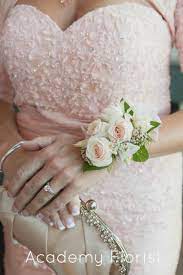 Alternatively, they can carry a miniature bouquet or a single stem. Mother Of The Bride Corsage Wrist Corsage Wedding Mother Of Bride Corsage Corsage Wedding