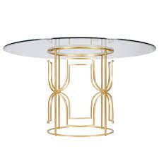 The 54 round bevelled glass dining table features a cross design with a round wood ring for extra support and sturdiness. Worlds Away Jennifer Gold Leaf Dining Table I Layla Grayce