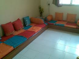Low Seating Arrangement In Traditional Indian Colours Indian Sofa Sofa Sofa Set