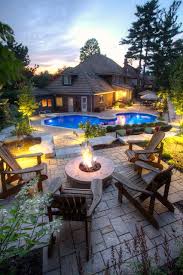 Inspiration for a large asian partial sun backyard gravel landscaping in melbourne with a fire pit. 20 Sophisticated Outdoor Fire Pit Designs Near The Swimming Pool