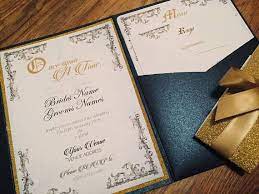 The laser cut wrap in navy shimmer hold a classically styled invitation featuring a single red rose. Beauty And The Beast Invite Be Our Guest Fairytale Wedding Invitation Once Apon A Time Pocket Fold Invite Navy And Gold Fairytale Wedding Invitations Beauty And The Beast Wedding Invitations Disney