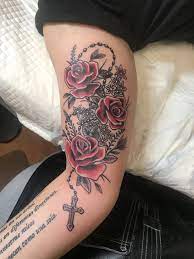 Symbolically, mary is also represented as a rose. Roses Rosary Tattoo Cover Up Rose Tattoos For Women Rosary Tattoo Rose Tattoos