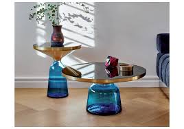 Rather than a solid block in the center of the room, a translucent tabletop allows for more visual flow. Bell Classicon Side Table Milia Shop