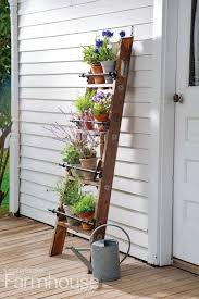Employ A Weathered Wooden Ladder To Hold Potted Plants Or A Collection Of Your Favorite Herbs For More Ideas On Porch Plants Potted Plants Patio Diy Garden