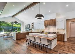 The large, minimalist entrance door made of glass opens into a large, plain modern entrance area. Kris Jenner Is Buying Calabasas House In Hidden Hills For 9 3 Million Observer