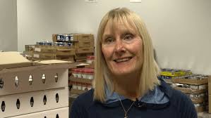 Volunteers with Leelanau Christian Neighbors pack meals for children in need