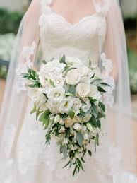 A bright rustic wedding bouquet with yellow roses, berries, daisies, eucalyptus, neutral blooms and billy balls is amazing. 52 Ideas For Your Spring Wedding Bouquet Martha Stewart