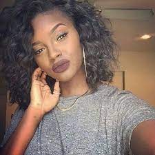 Curls can also be achieved with a flat iron. Hugedomains Com Short Curly Weave Hairstyles Curly Weave Hairstyles Short Curly Weave