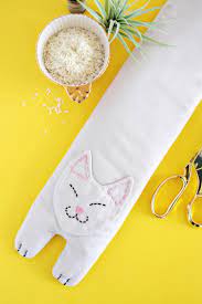 You don't really have to search for market places to find a heating pad for yourself, because now you can make one. Kitty Rice Heating Pack Diy A Beautiful Mess
