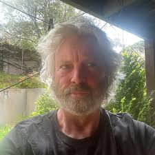 Is it ok to just leave a round bale of hay out for my goats to eat. We  built a covered feeder for square bales but can only find round bales right