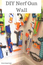 Now take out all of your airsoft guns, nerf guns, foam swords, minecraft pickaxes, and whatever else you would like to hang and start to add it. Make Your Own Easy Diy Nerf Gun Wall