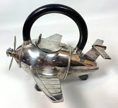 Sold Price: AIRPLANE FORM SILVERPLATE COCKTAIL SHAKER. HANDLED. - September  2, 0120 10:00 AM EDT