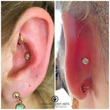 Conch Piercing With 18k Yellow Gold Prong Set Cz S From Anatometal Cool Ear Piercings Cute Ear Piercings Ear Piercings